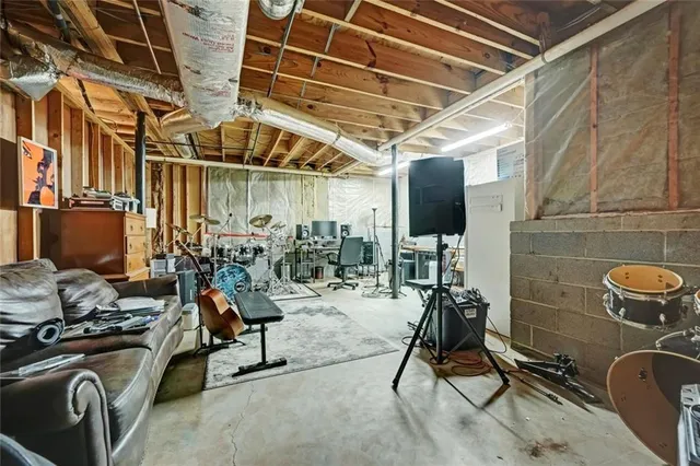 a view of a hallway with wooden floor and entryway