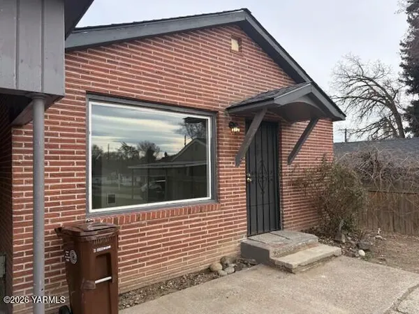 a front view of a house with glass windows