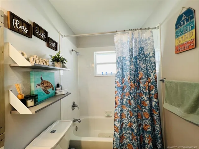 a view of a workspace with furniture and a kitchen