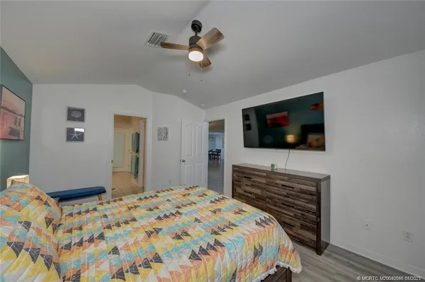 a room with pool table and window