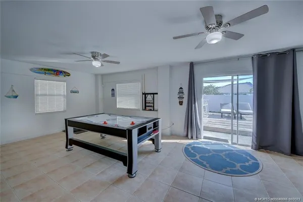 a view of a livingroom with furniture and a chandelier