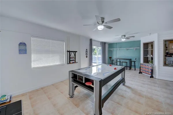 an aerial view of a house with a garden and lake view