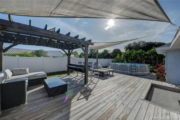 an aerial view of a house with a lake view