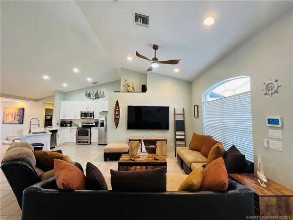 a living room with furniture and a flat screen tv