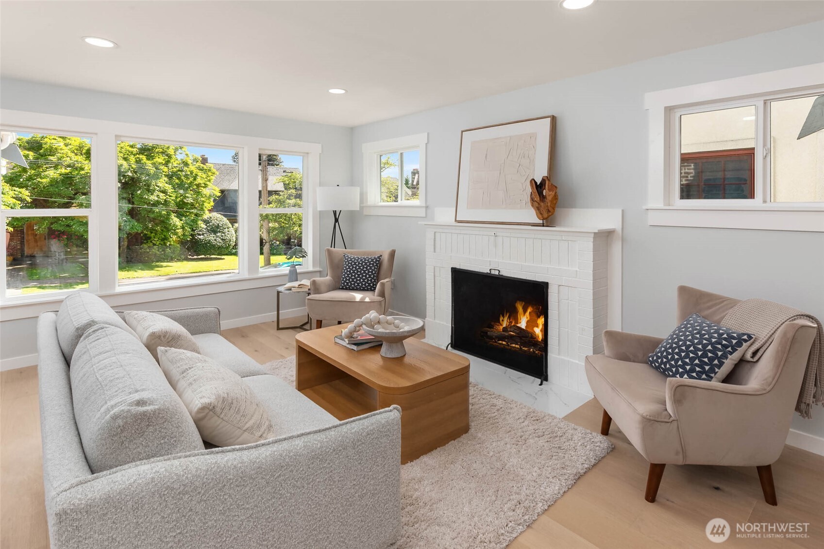 1312 Northeast 70th Street Seattle, WA 98115 - Photo 3 of 36 a living room with furniture and a fireplace