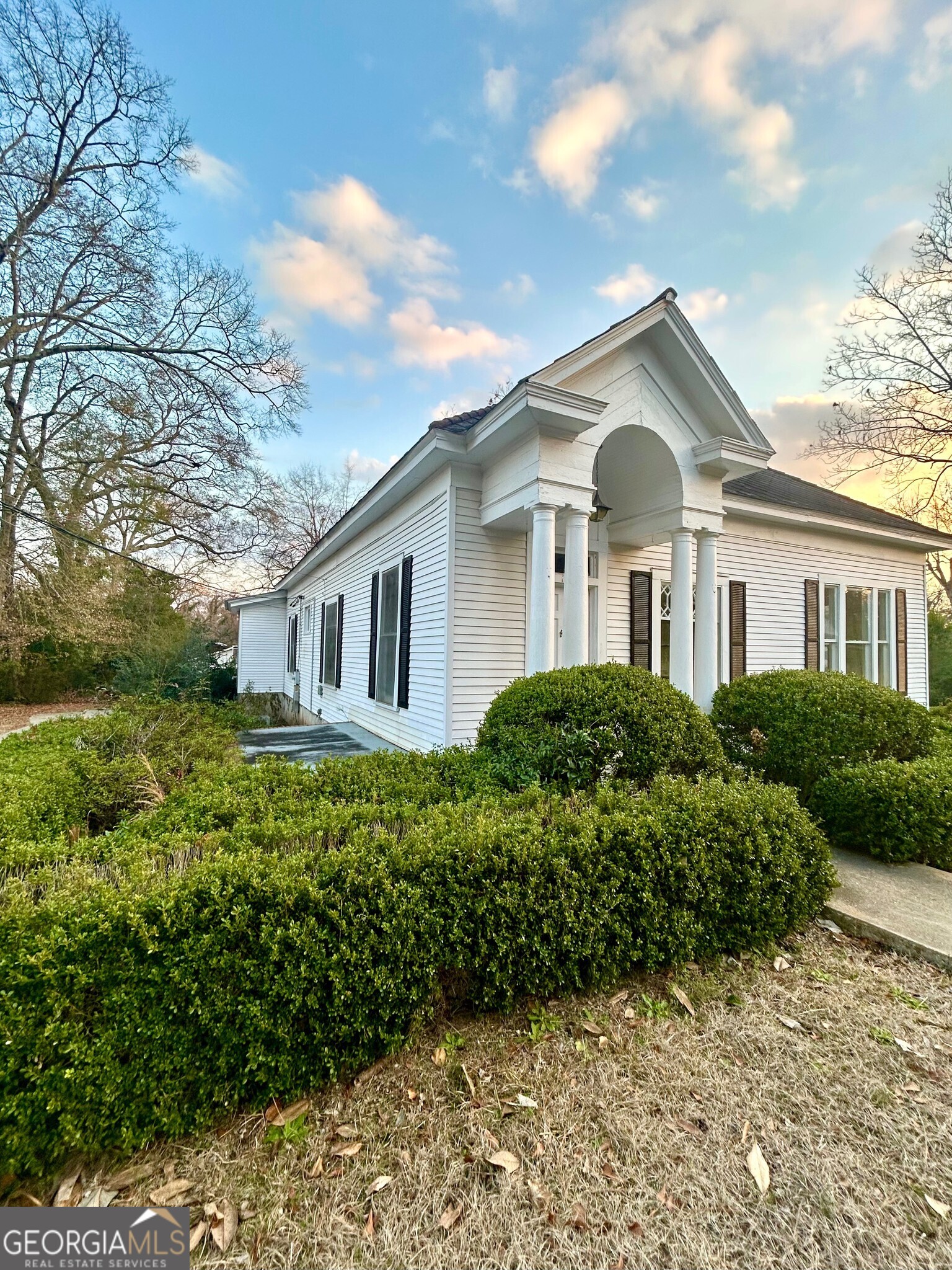 42 West Harris Street Cuthbert, GA 39840 - Photo 2 of 4 a front view of a house with a yard