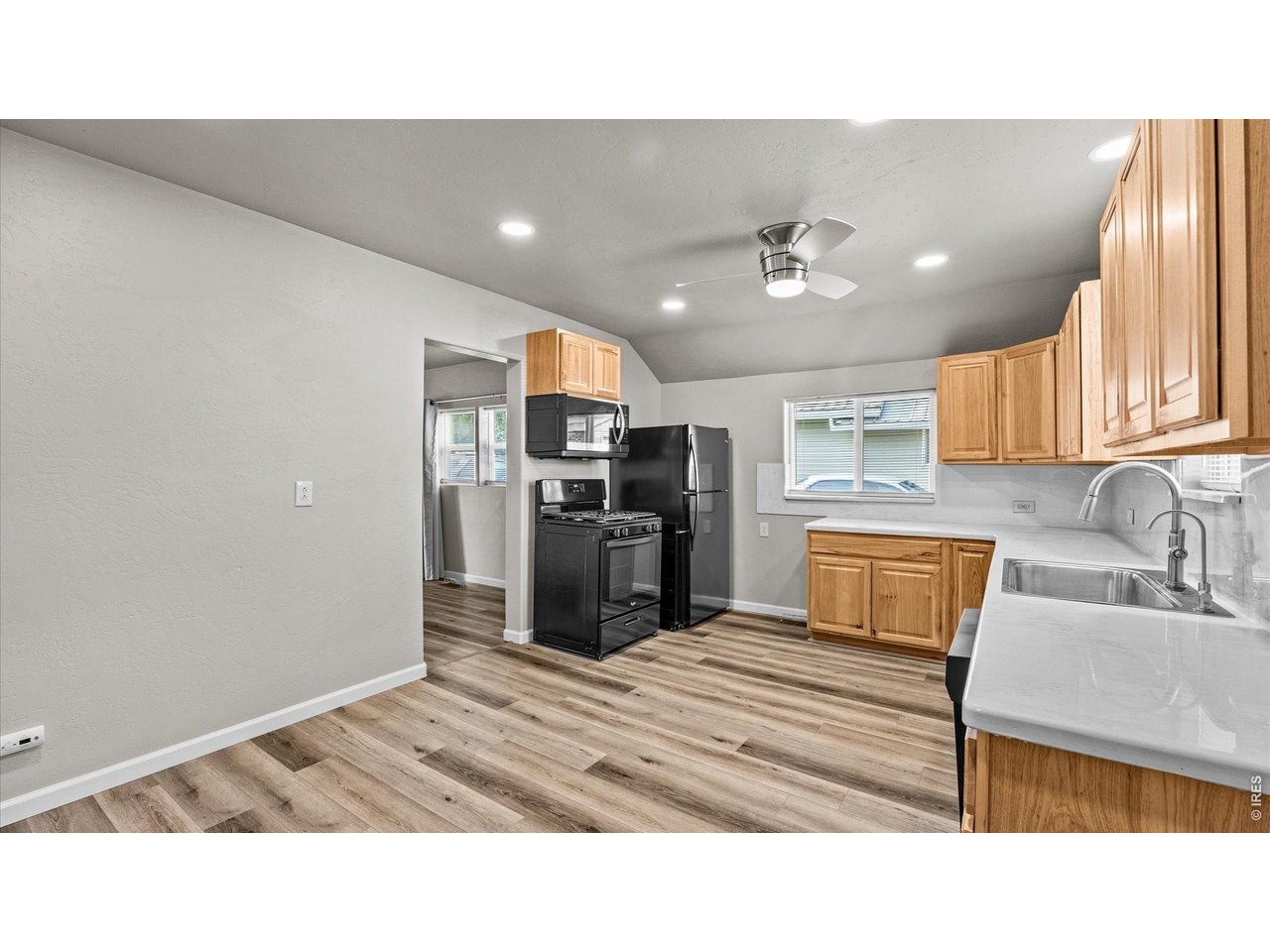 632 Minter Avenue De Beque, CO 81630 - Photo 10 of 26 a kitchen with a refrigerator sink and cabinets