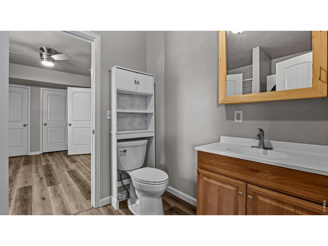 632 Minter Avenue De Beque, CO 81630 - Photo 15 of 26 a bathroom with a sink toilet and mirror
