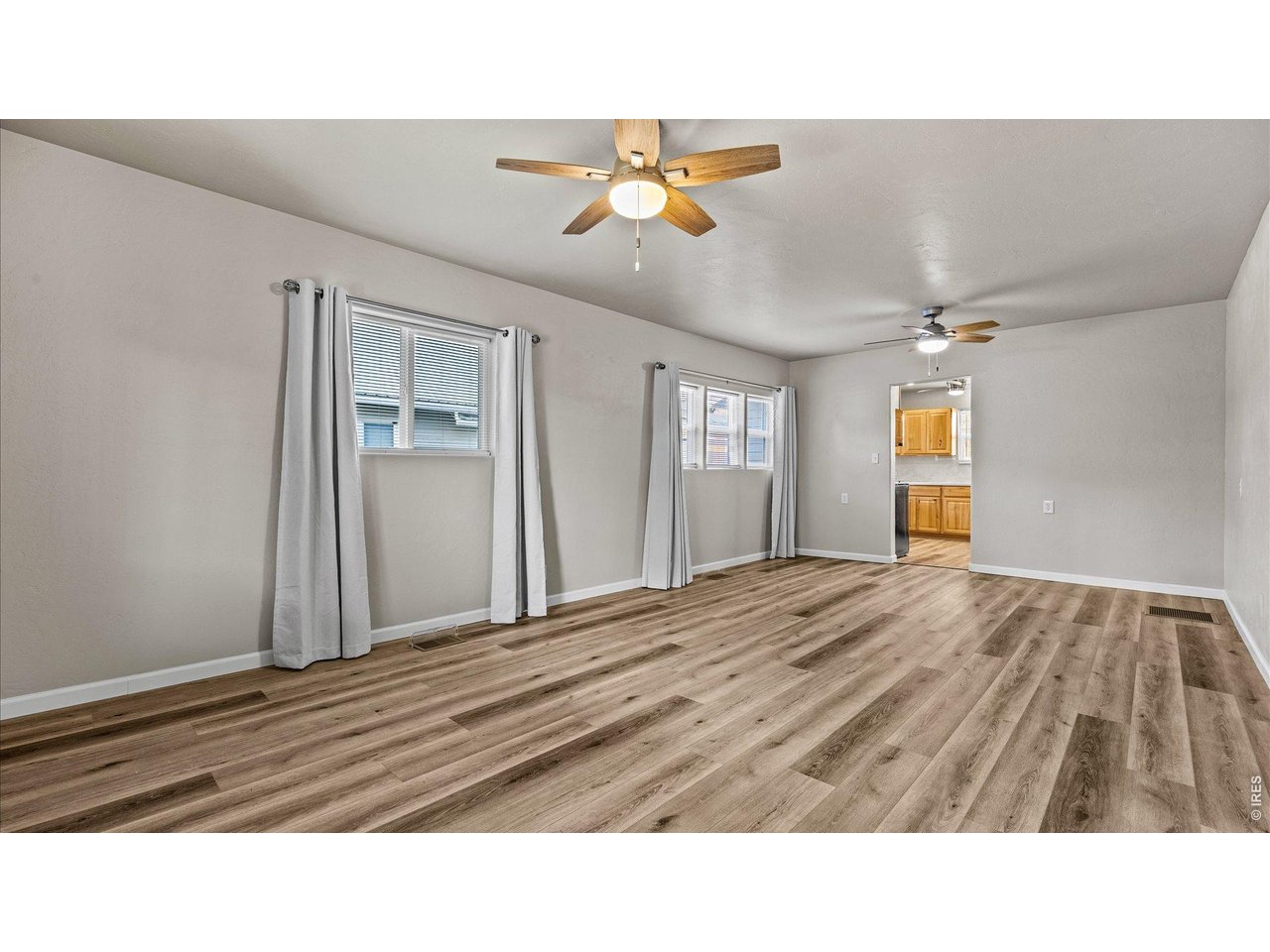 632 Minter Avenue De Beque, CO 81630 - Photo 7 of 26 a living room with a bed furniture and a window