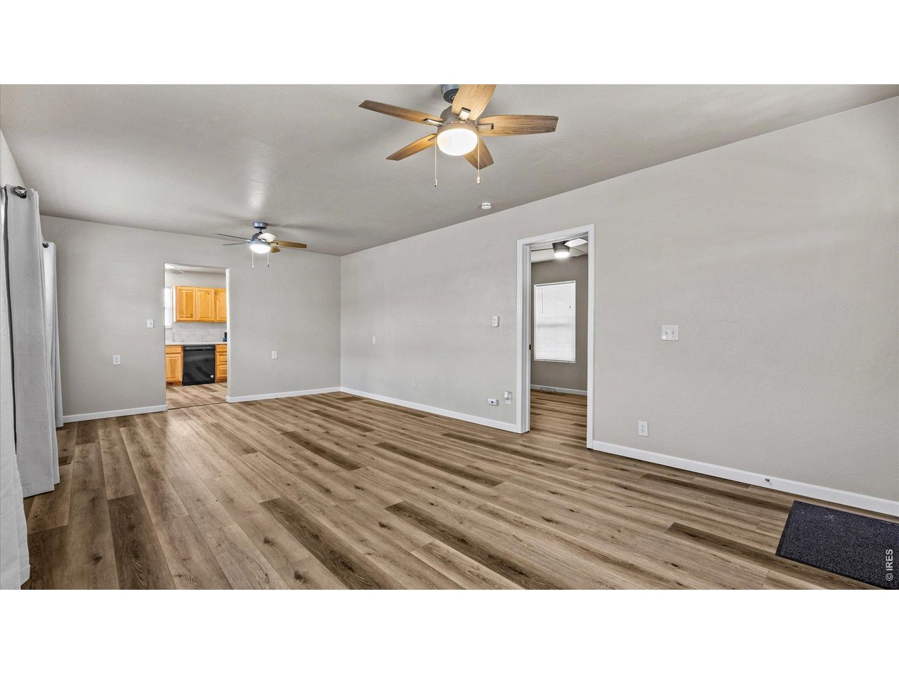 632 Minter Avenue De Beque, CO 81630 - Photo 8 of 26 a view of an empty room and wooden floor