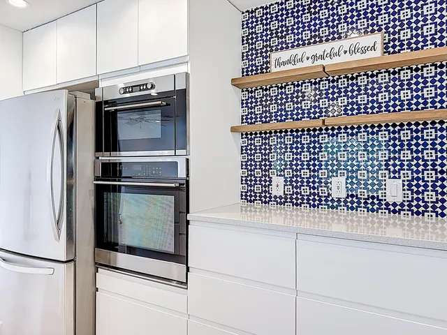 a view of kitchen with microwave and furniture