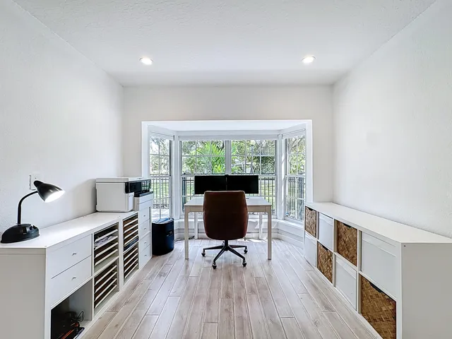 an empty room with wooden floor