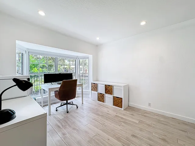 a bathroom with a toilet a sink and a mirror