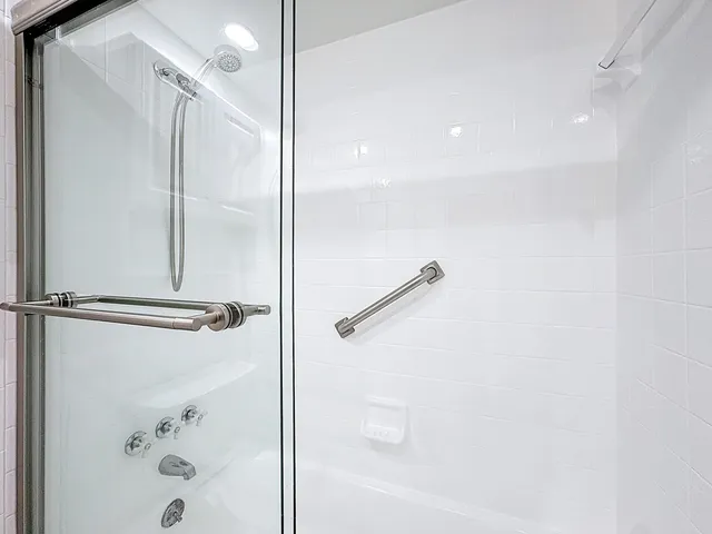 a bedroom with a bed and a desk