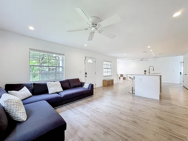 a living room with furniture and a large window