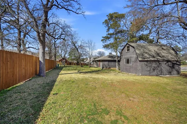 a view of yard with swimming pool