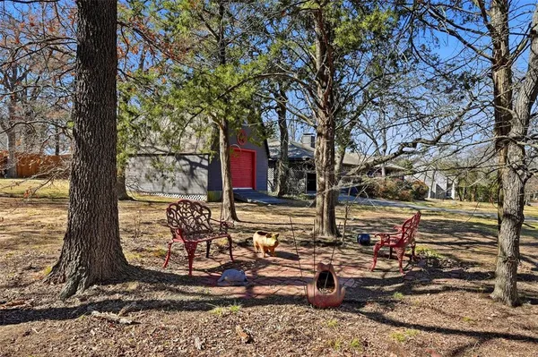 a view of a tree in front of a house