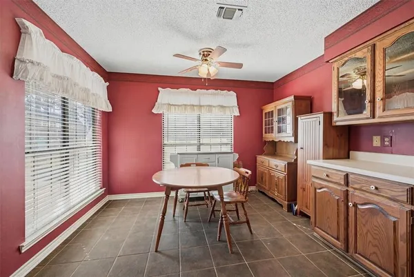 a room with furniture a chandelier a mirror and a sink