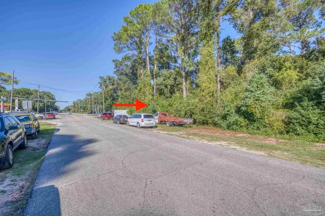 a view of a street with cars