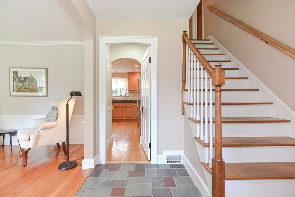 11 Wilde Road Wellesley, MA 02481 - Photo 14 of 26 a view of staircase with lots of frames and couches