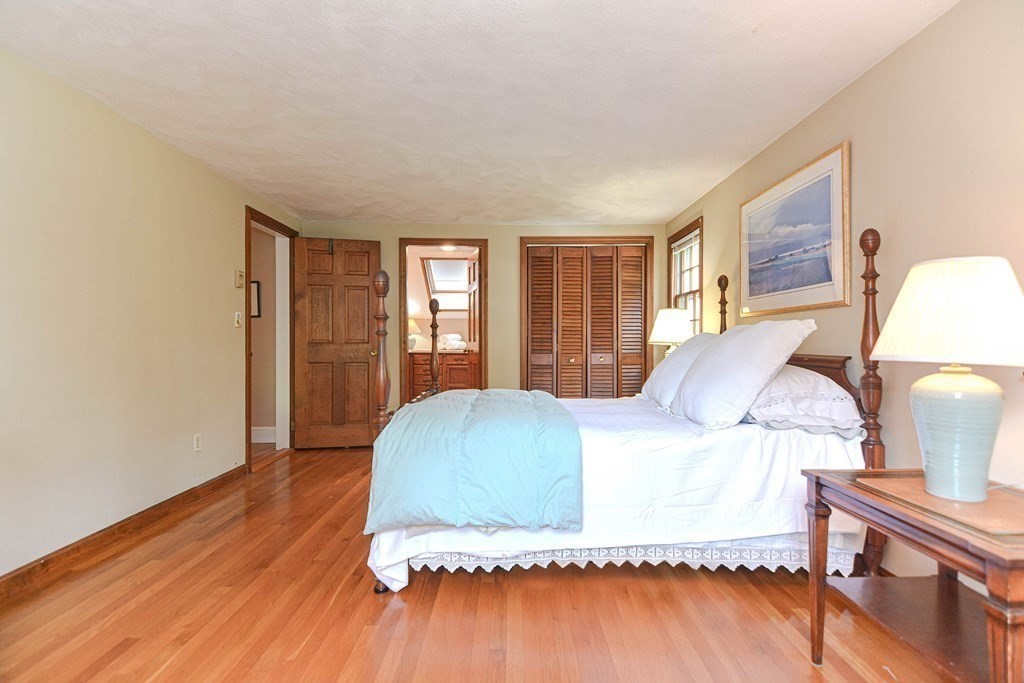 11 Wilde Road Wellesley, MA 02481 - Photo 15 of 26 a bedroom with a bed and wooden floor