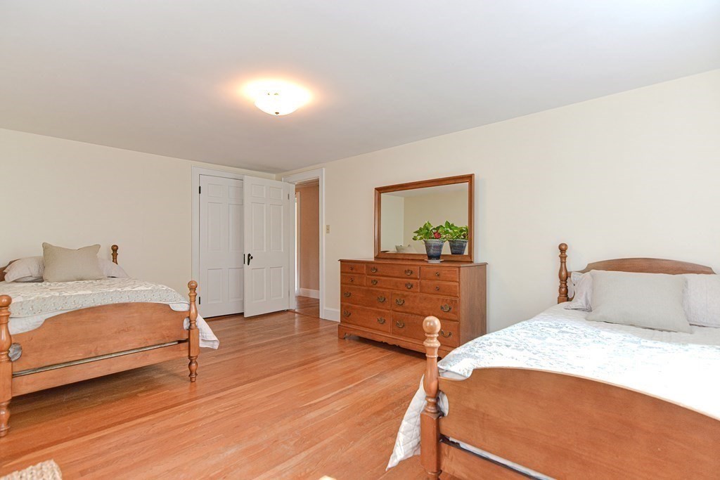 11 Wilde Road Wellesley, MA 02481 - Photo 19 of 26 a bedroom with a bed and a dresser