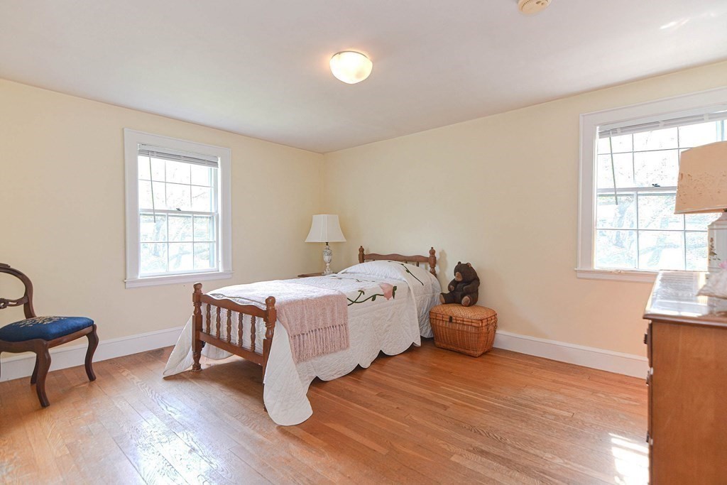 11 Wilde Road Wellesley, MA 02481 - Photo 20 of 26 a bed room with a bed and a chair