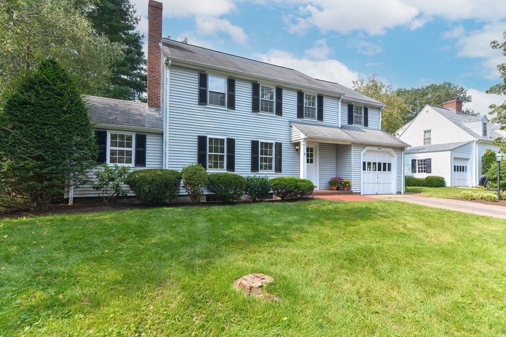 11 Wilde Road Wellesley, MA 02481 - Photo 23 of 26 a front view of a house with a yard and garage