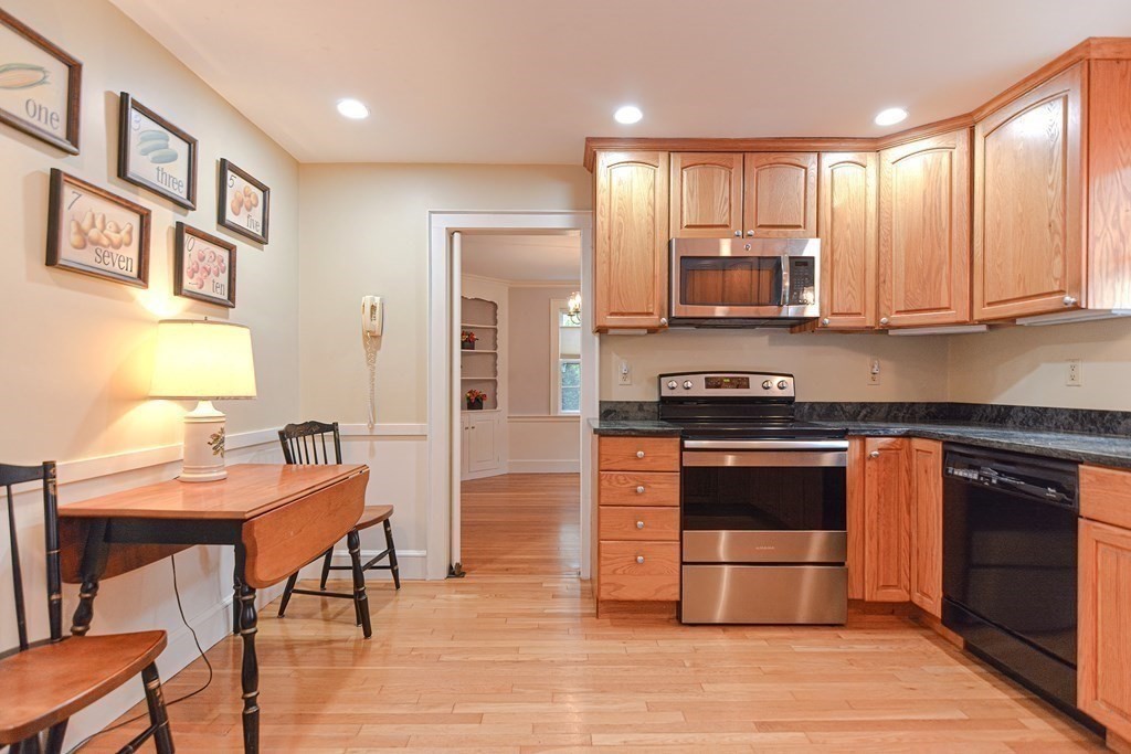 11 Wilde Road Wellesley, MA 02481 - Photo 9 of 26 a kitchen with stainless steel appliances granite countertop a stove a sink and a refrigerator