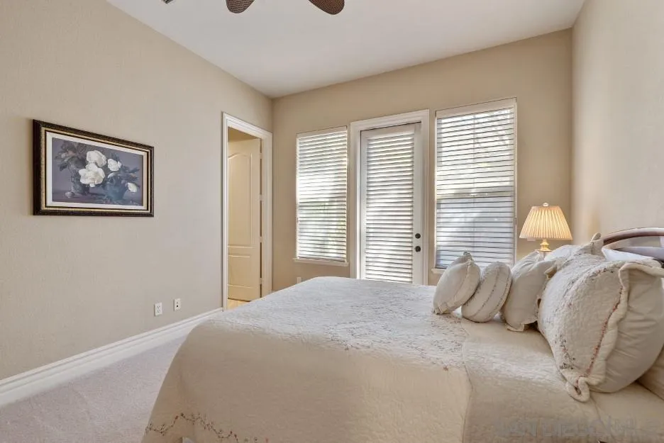 14032 Lake Poway Road Poway, CA 92064 - Photo 28 of 51 a bedroom with a bed and a window