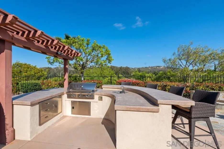 14032 Lake Poway Road Poway, CA 92064 - Photo 41 of 51 a view of a patio with a table and chairs