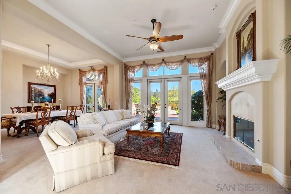 14032 Lake Poway Road Poway, CA 92064 - Photo 6 of 51 a living room with furniture a fireplace and a large window