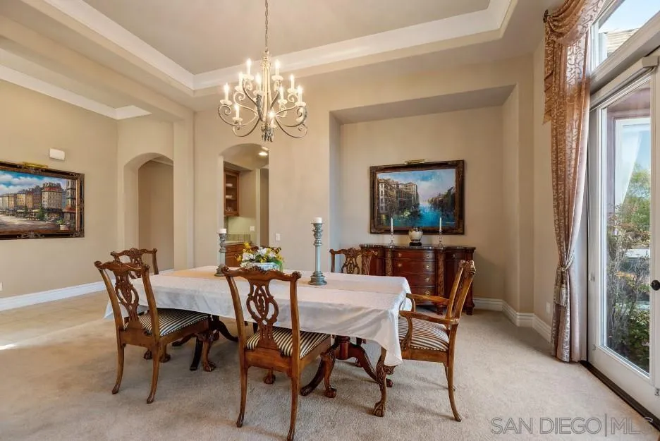 14032 Lake Poway Road Poway, CA 92064 - Photo 7 of 51 a view of a dining room with furniture and a chandelier