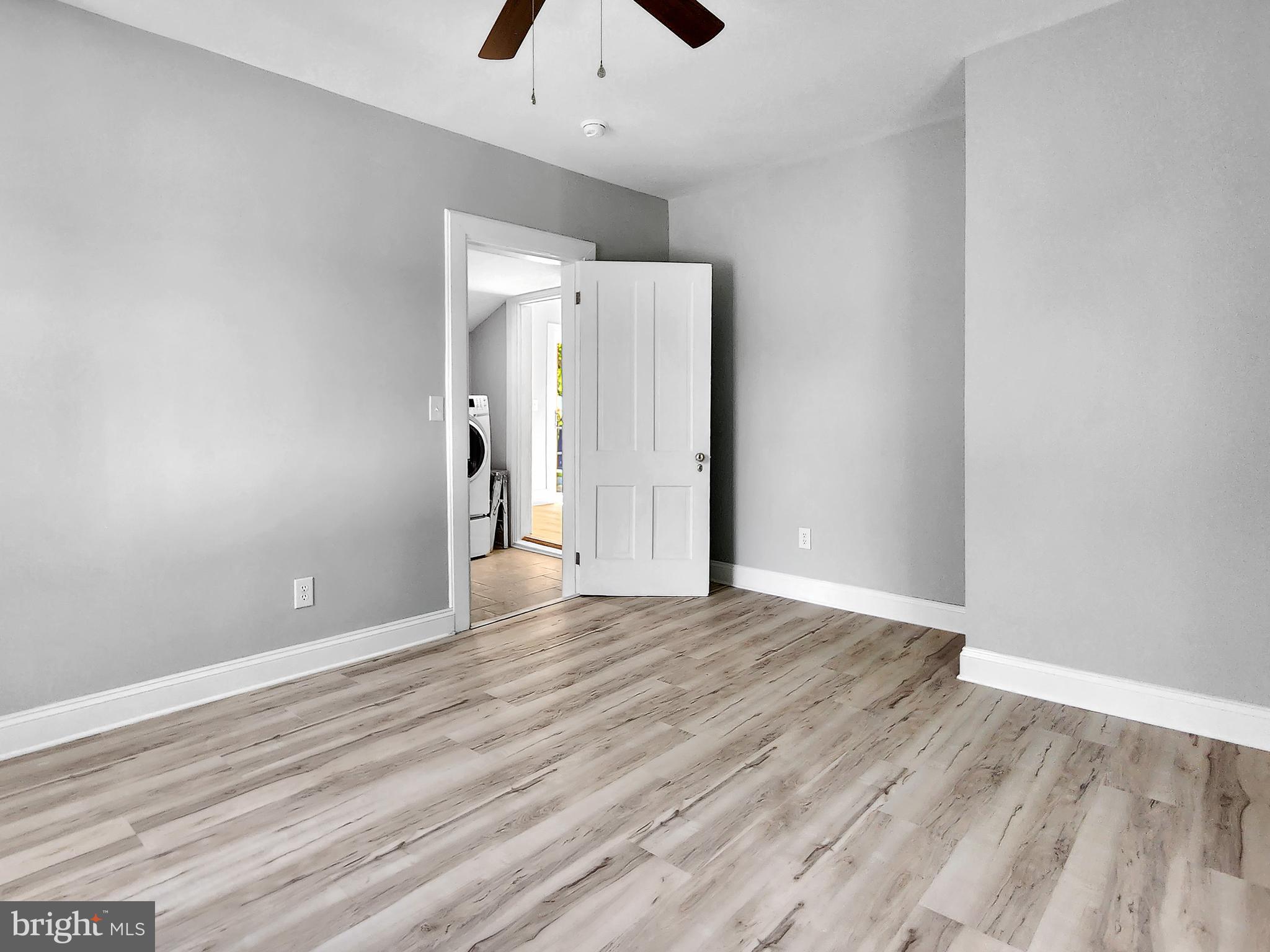 30181 Temperanceville Road Temperanceville, VA 23442 - Photo 17 of 41 a view of an empty room with wooden floor