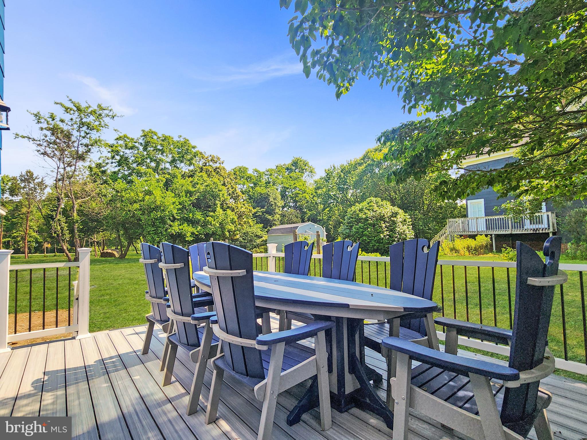 30181 Temperanceville Road Temperanceville, VA 23442 - Photo 19 of 41 a view of a chairs and table on the deck