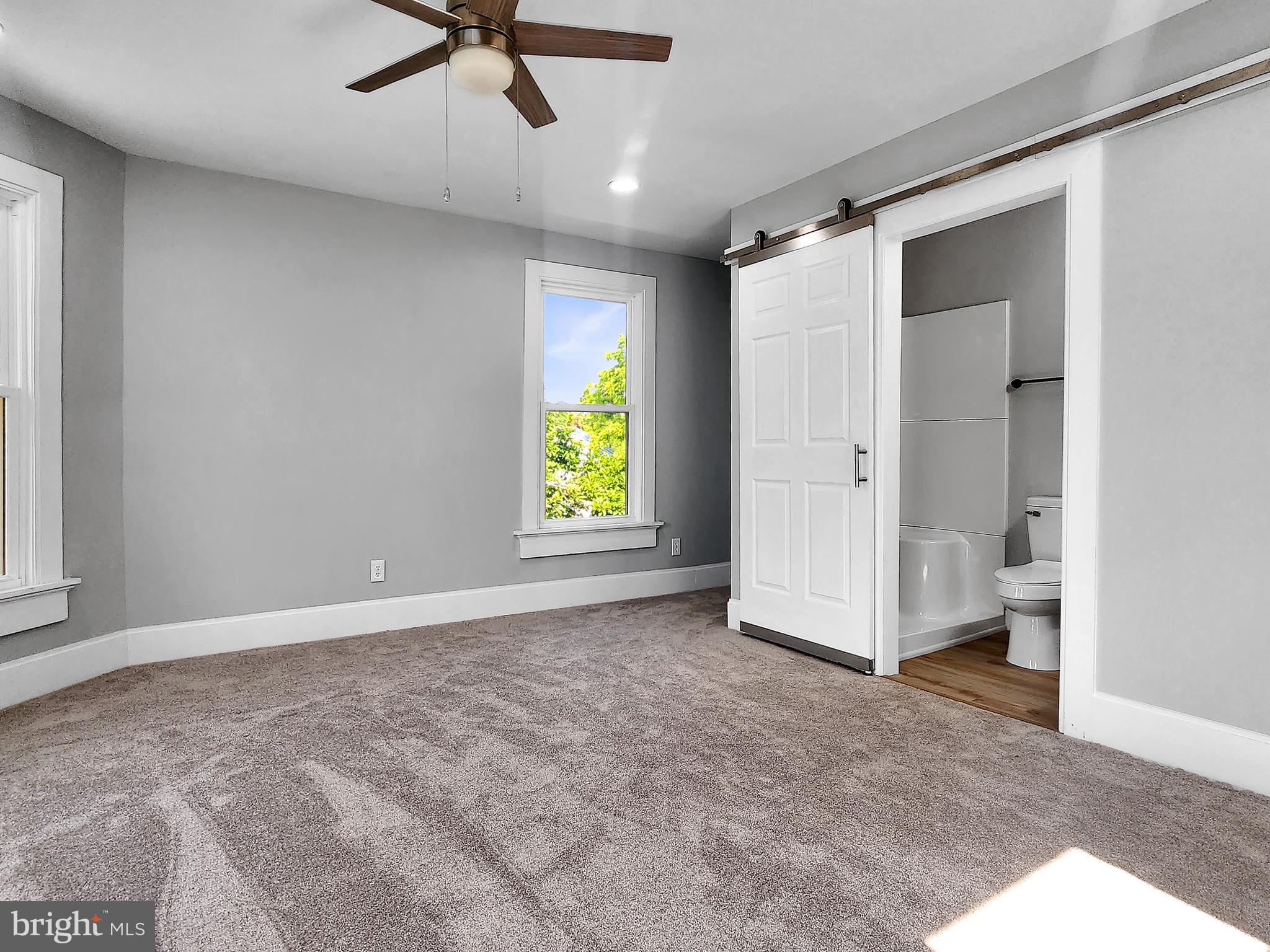 30181 Temperanceville Road Temperanceville, VA 23442 - Photo 22 of 41 an empty room with window and a ceiling fan