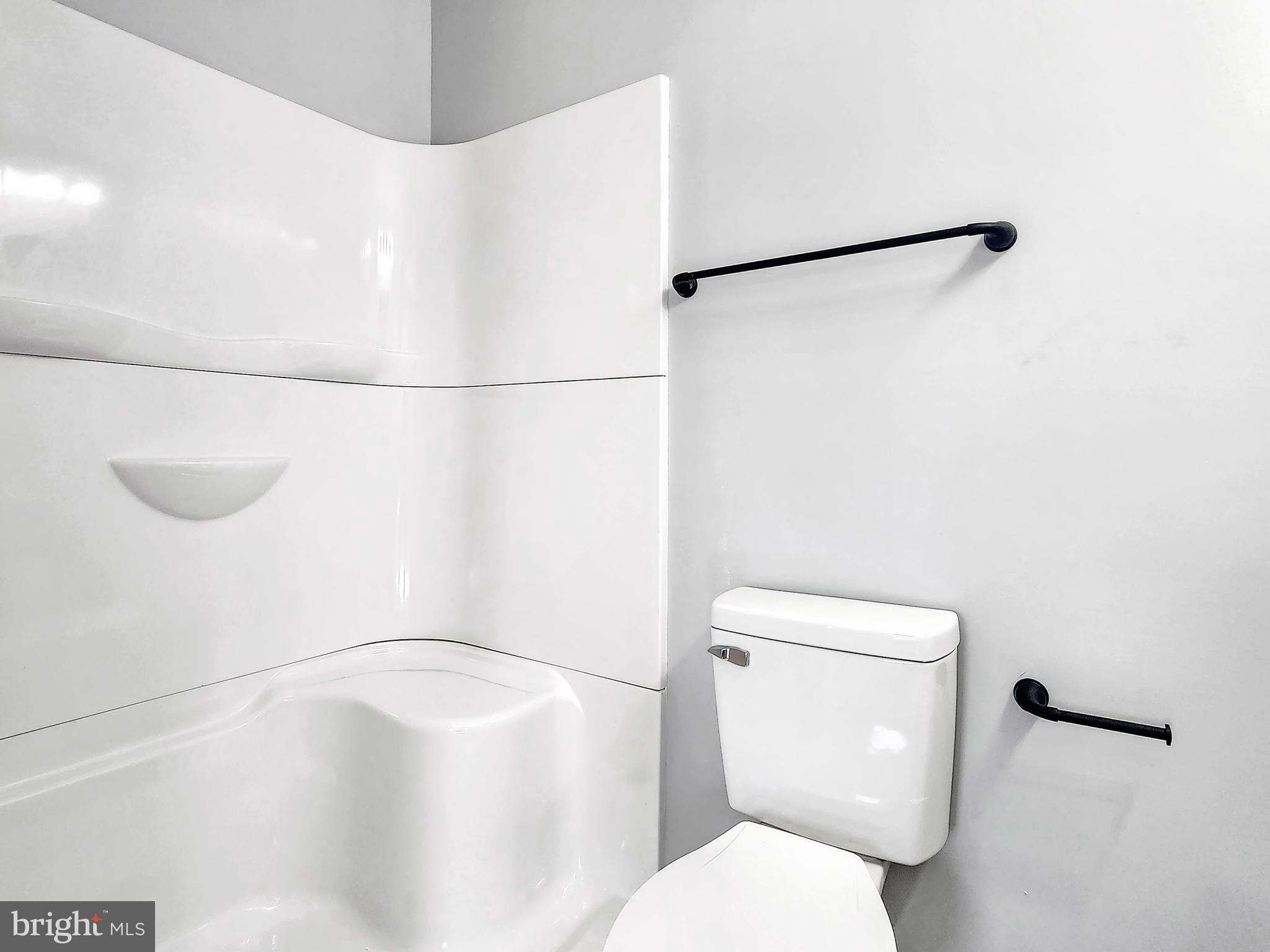 30181 Temperanceville Road Temperanceville, VA 23442 - Photo 26 of 41 a white toilet sitting next to a shower