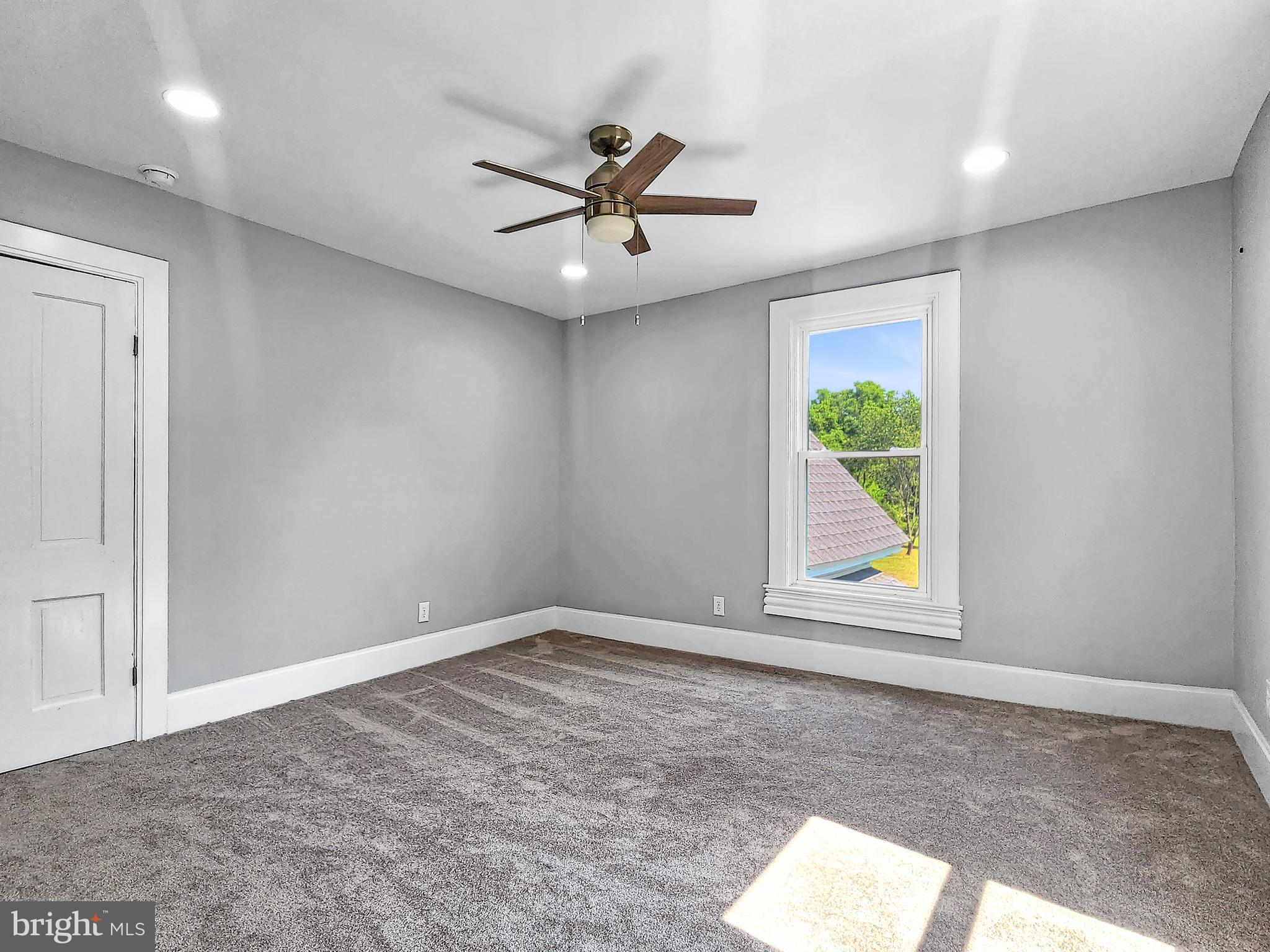 30181 Temperanceville Road Temperanceville, VA 23442 - Photo 37 of 41 an empty room with window and stainless steel appliances
