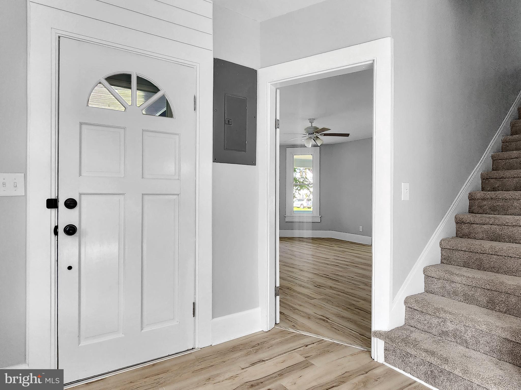 30181 Temperanceville Road Temperanceville, VA 23442 - Photo 4 of 41 a view of a hallway with wooden floor and staircase