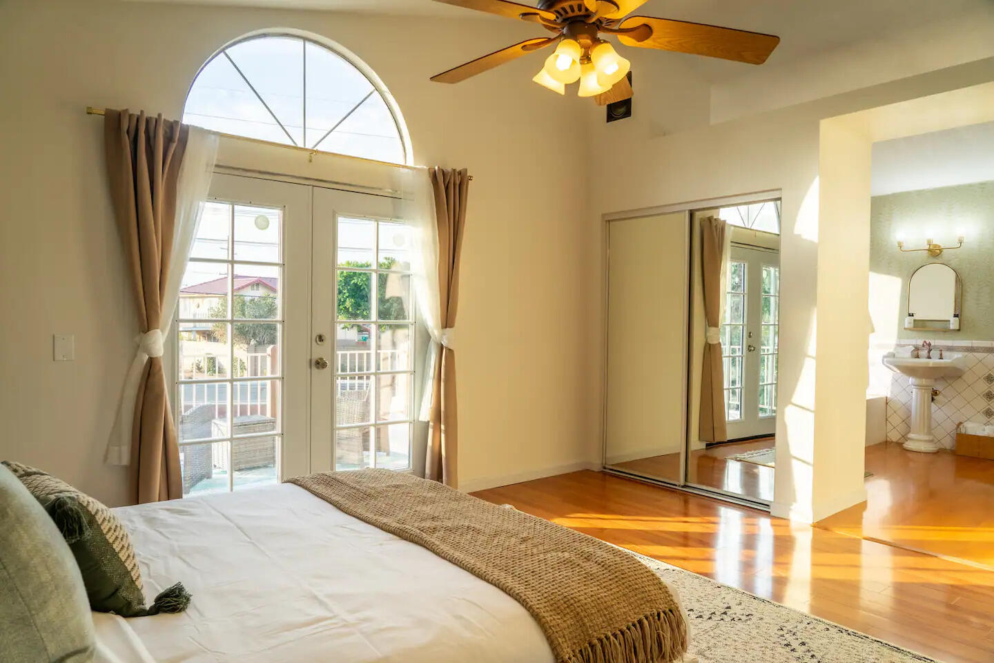 81032 Red Bluff Road Indio, CA 92201 - Photo 17 of 33 a bedroom with a bed and a chandelier