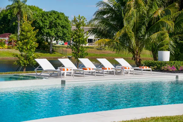 a view of an swimming pool with seating area