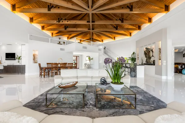 a view of a living room and kitchen