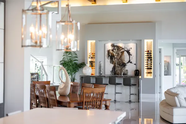 a view of a dining room with furniture and chandelier
