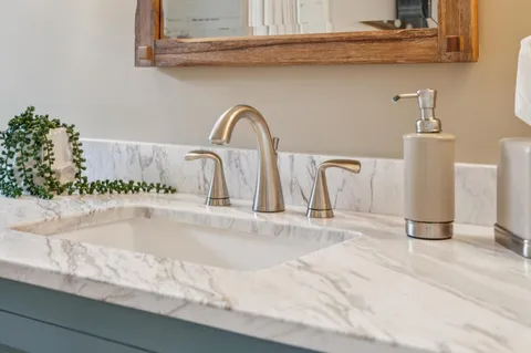 a bathroom with a bathtub and shower