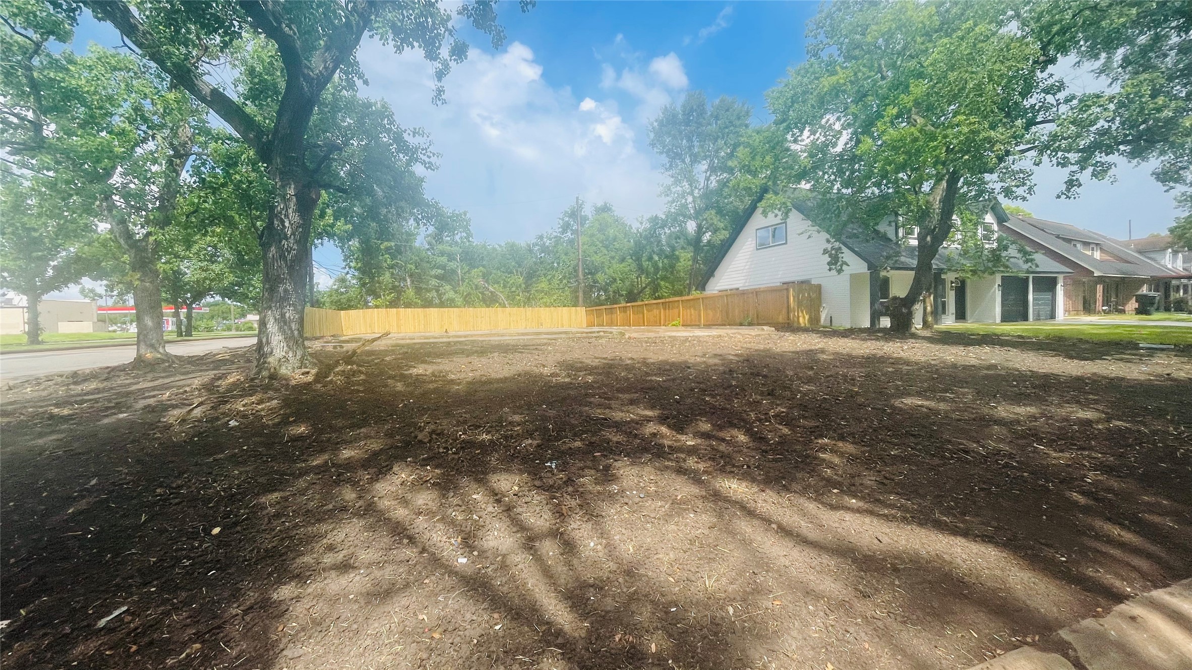 5622 Grace Point Lane Houston, TX 77048 - Photo 6 of 6 a view of a yard with a house in the background