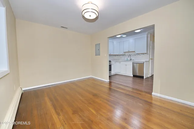 a view of kitchen and wooden floor