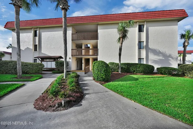 a view of hallway with wooden floor