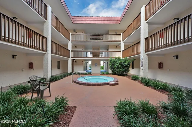 a stove top oven sitting inside of a kitchen