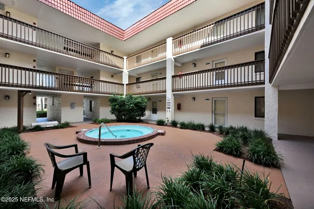 a kitchen with a sink and a refrigerator
