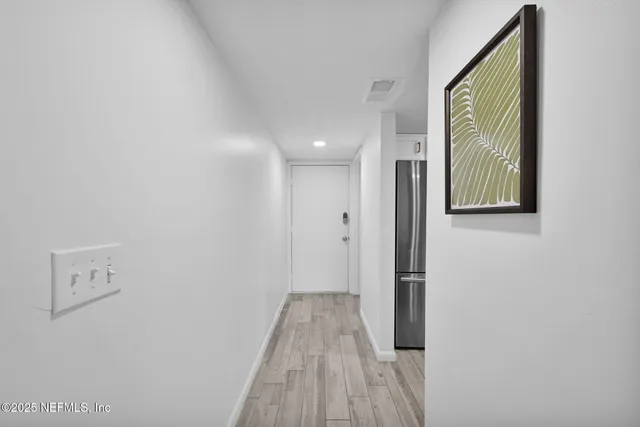 a table with a vase and flowers on it